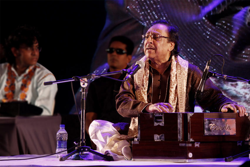 person singing Qawwali on stage