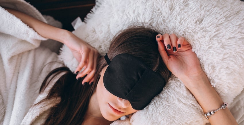 woman-bed-wearing-sleeping-mask
